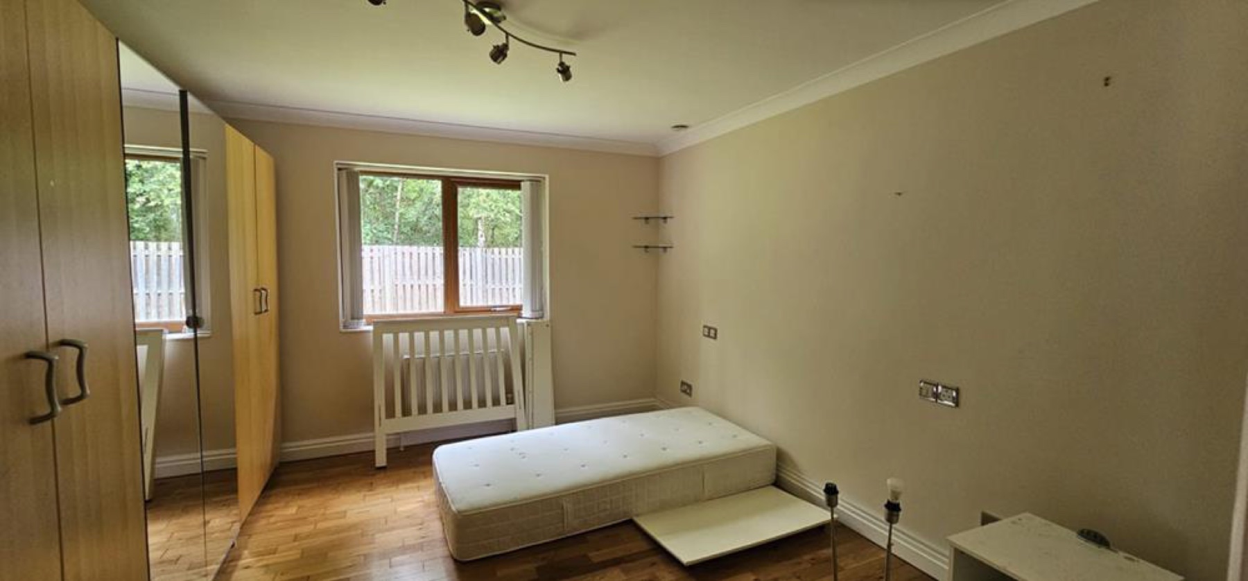 Garden Room: Before, the dated downstairs bedroom