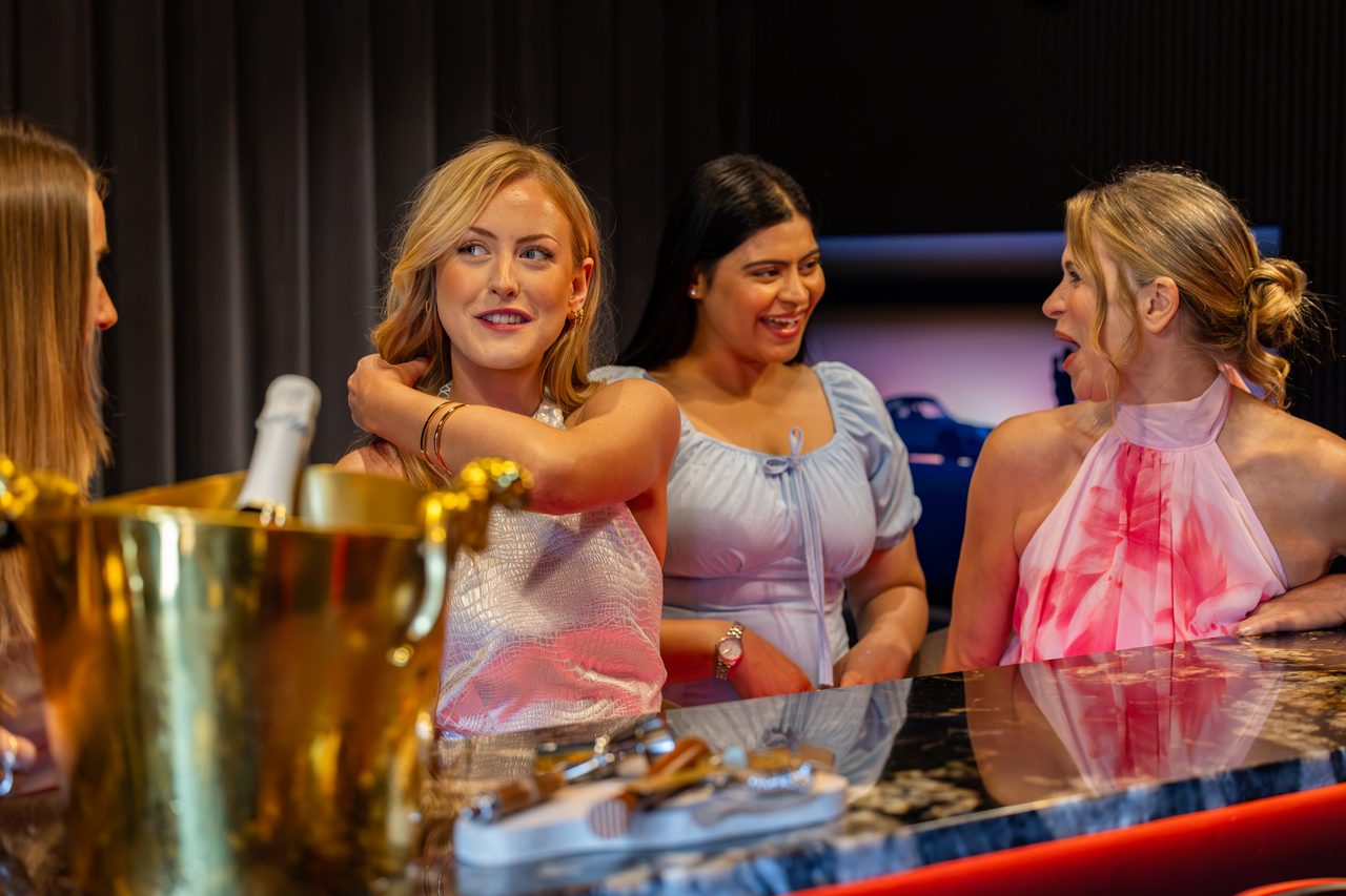 Guests laughing at the Warren House private bar