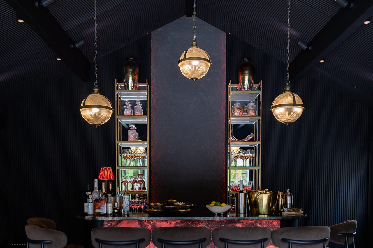 The backlit Warren House bar at night