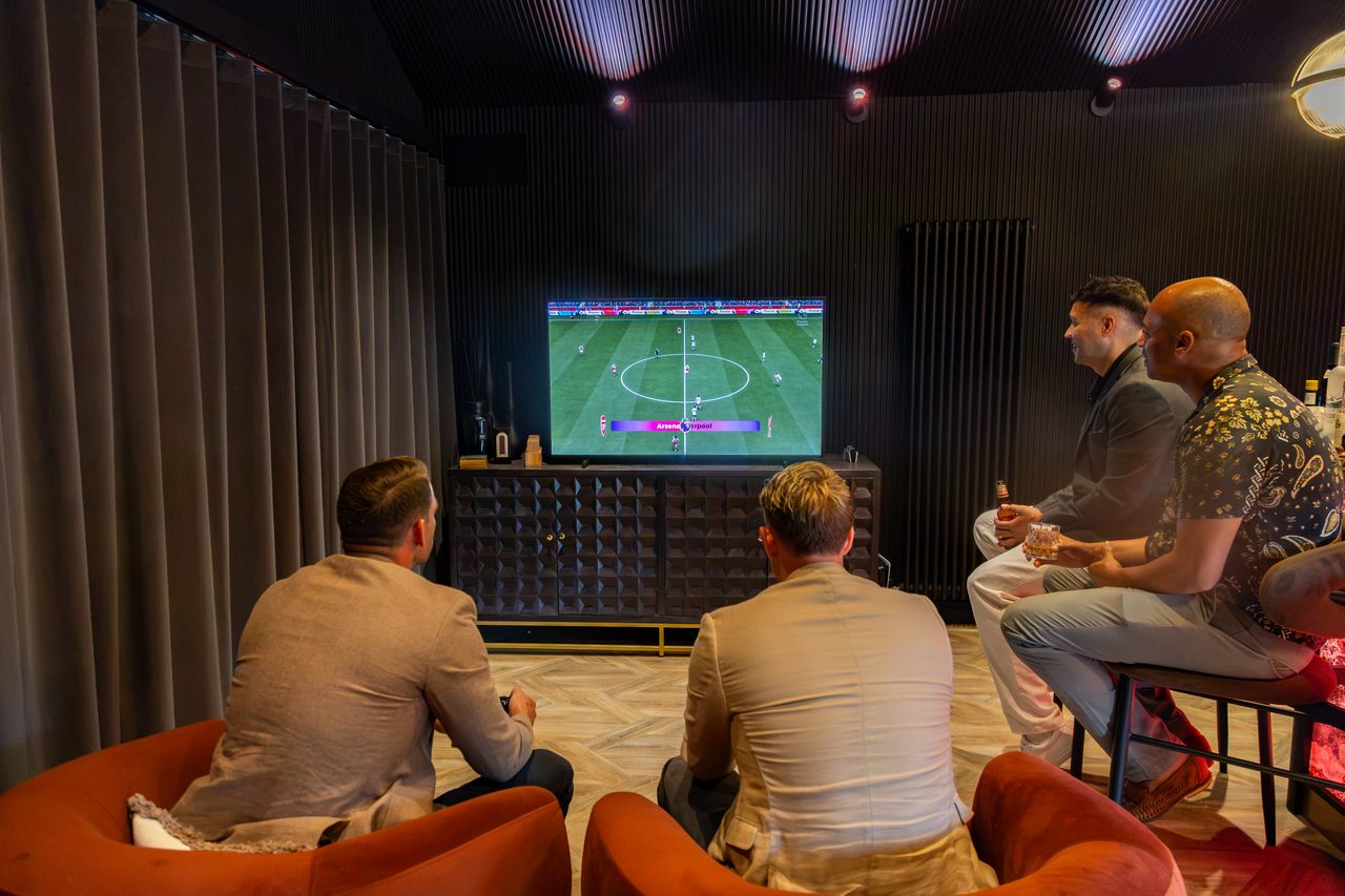 The lads watching the match on the big screen at Warren House