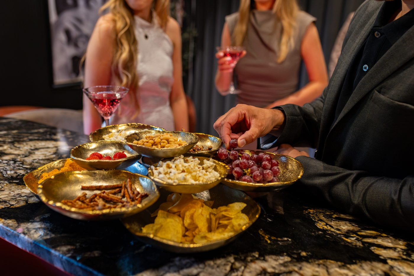 The marble bar at Warren House laid with sharing boards and cocktails