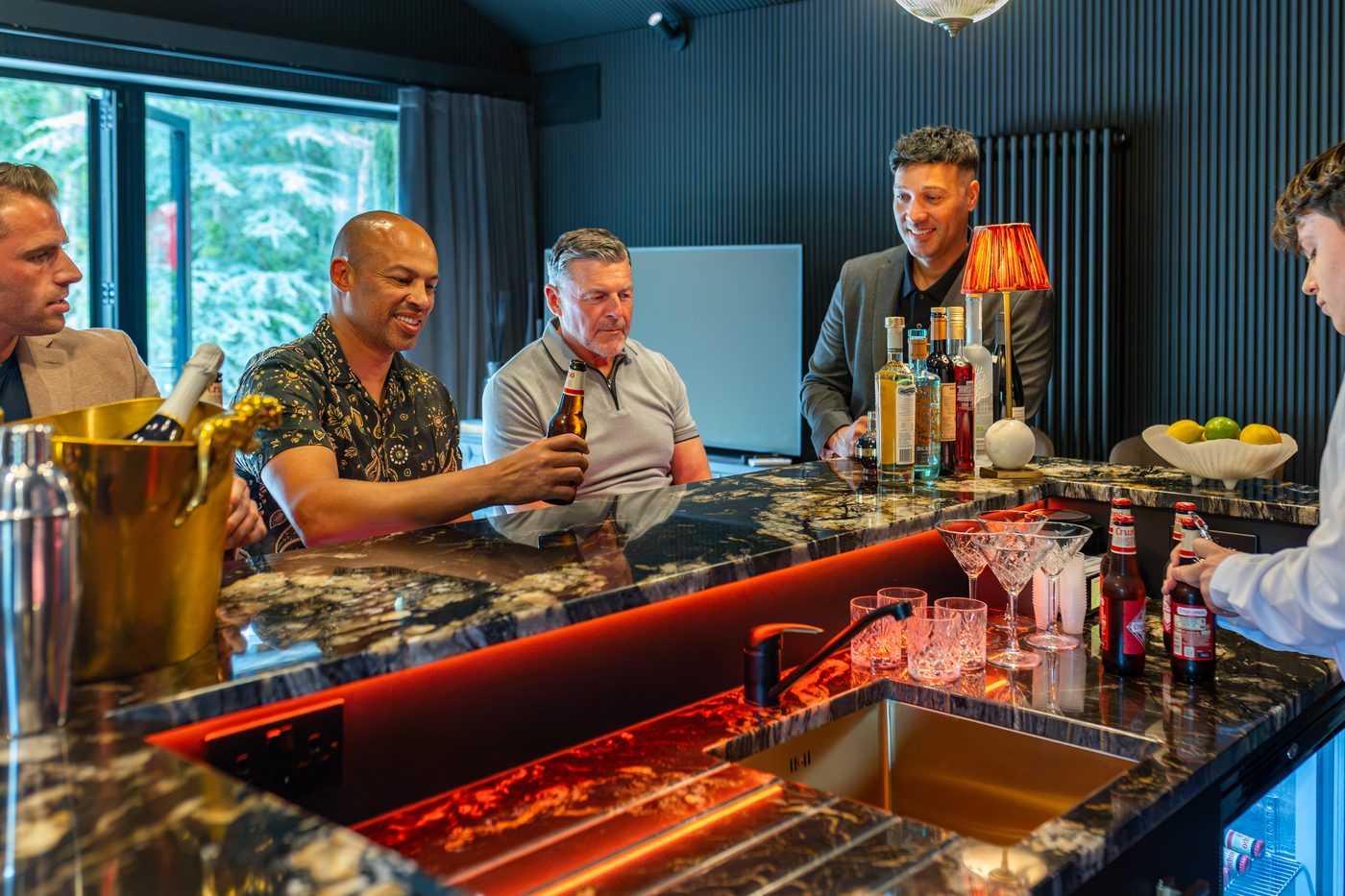 The lads toasting at the marble bar at Warren House