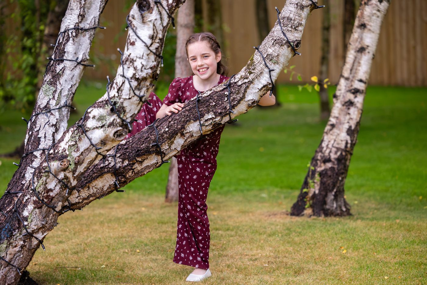 A child exploring the silver birches at Warren House