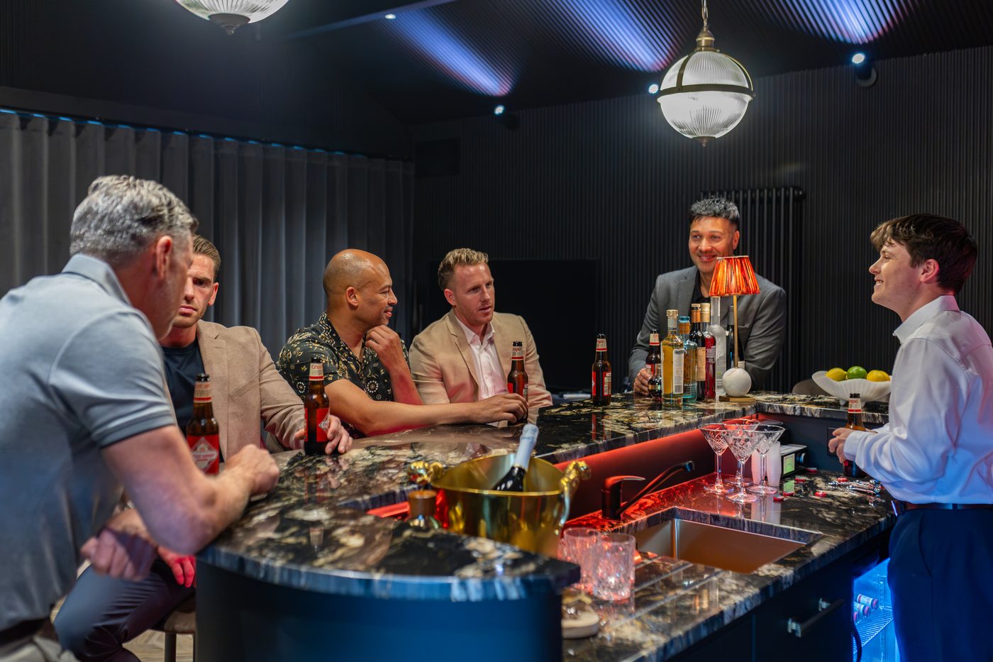 Drinks being poured for the group at the marble bar at Warren House