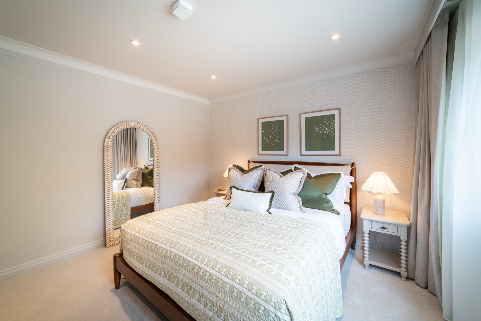 The Dove Room at Warren House, a serene king-size bedroom with an arched mirror